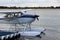 White seaplane docked at sea side jetty