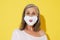 White senior woman posing in face mask expressing surprise on camera