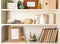 White shelving unit with books and decorative elements