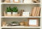 White shelving unit with different decorative elements