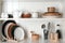 White shelving unit with set of dishware