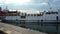 White ship departing from Vung Tau to Con Dao island leaving the docking position at the pier in harbor for departure.