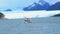 White ship running in front of Perito Moreno Glacier