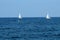 White ships sailboats or yachts floating in the sea