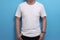 White shirt template, male model wearing white shirt against blue background