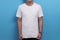 White shirt template, male model wearing white shirt against blue background