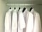 White shirts hanging on the racks