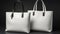 White shopping bags on dark background with copy spaceGift shopping concept, retail therapy.