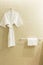 White shower gown and small towels