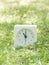 White simple clock on lawn yard, 11:00 eleven o`clock