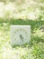 White simple clock on lawn yard, 4:25 four twenty five