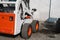 White skid steer loader at a construction site waiting of work. Industrial machinery. Industry.