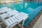 White sleeping chair and pool in light blue color