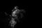 White smoke on black background. Monochrome, grayscale photography of illuminated incense. Moody feeling.
