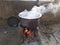 White smoke coming out from the pan. Cooking Rajasthani food on mud challah or stove or oven