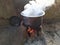 White smoke coming out from the pan. Cooking Rajasthani food on mud challah or stove or oven