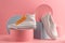 White sneaker and loafer on pink background