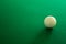 White snooker ball on green table background. the white snooker ball on the right side of picture