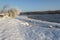 White snow and dark water of the river.