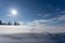 White snowy Latvian landscape in winter where you can see a large field