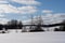 White snowy Latvian landscape in winter where you can see a large field