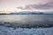 White snowy mountain on Svalbard, Norway. Ice in ocean, twilight