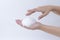 White soapy foam bubbles texture on hand. cleaning and wash essence facial cleanser skin care concept