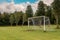 White soccer of football goal post on a grass field of a training ground