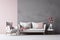 White sofa and armchair with pink cushions against grey wall. Scandinavian interior design