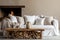 White sofa with blanket and wooden coffee table against fireplace with firewood stack