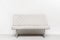 White sofa near white wall in interior. Minimalism modern design