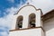 White Spanish mission church bell tower with two bells in Santa Barbara, California, USA