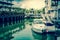 White speed boat at the pier, Vintage style photograph