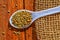 White spoon in pearl millets,bajra on wooden table,Millet bajri seed,bajra  grain with white spoon