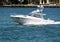 White sport fishing boat with tuna tower