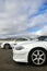 White sports cars at racetrack