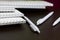 White spring pads and ballpoint pens for notes and sketches. Stationery for school and teaching. On a dark background.