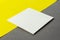 White square blank tear-off note paper on yellow gray background