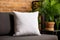White square canvas pillow mockup on cozy sofa in living room interior