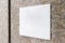 White square signboard on the marble wall of a modern business center, mock up