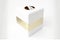 white square tissue box with gold stripe on white background