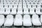 White stadium chairs covered in snow