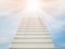 A white staircase stretches up the horizon. That means to be success or go to heaven