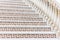 White stairs with mosaic tile with balusters. Abstract architecture interior fragment