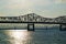 White, Steel Roadway River Bridge at Sunset