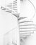 White steel spiral staircase and white wall