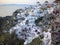 White step stone buildings blue windows Santorini island greece