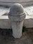 White stone bollard at sunset