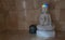 White stone Buddha with rainbow on hat