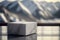 White stone podium made of stone, beautiful lanscape with mountains and blue sky on the background, platform for